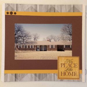 8x8 Scrapbook layout with woodgrain background paper, golden yellow & maroon mats, No Place Like Home sticker & enamel dots