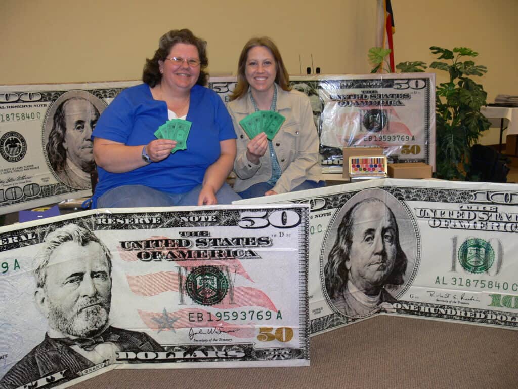 Janelle & Machelle with our "Scrapbook Money" we won at a scrapbook retreat